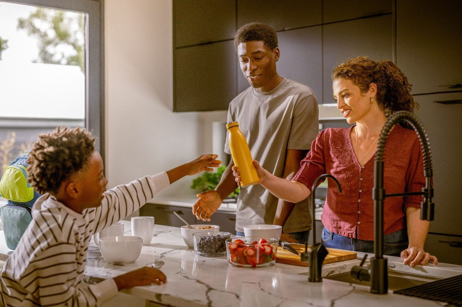 Family gathered in kitchen